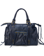 Navy - Navy blue leather handbag with gold accents on a white background
